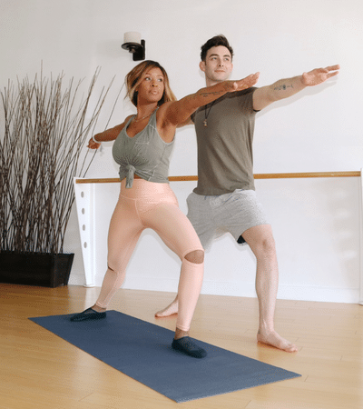 couple doing yoga class together at Las Vegas Pilates + Yoga studio
